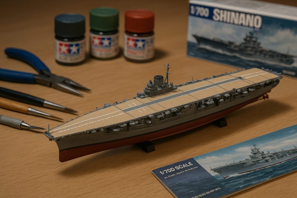 机の上に置かれた1/700スケールの信濃模型。工具・塗料とともに撮影された趣味雑誌風写真