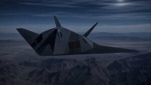 夜間の山岳地帯上空を飛行するF-117級ステルス攻撃機