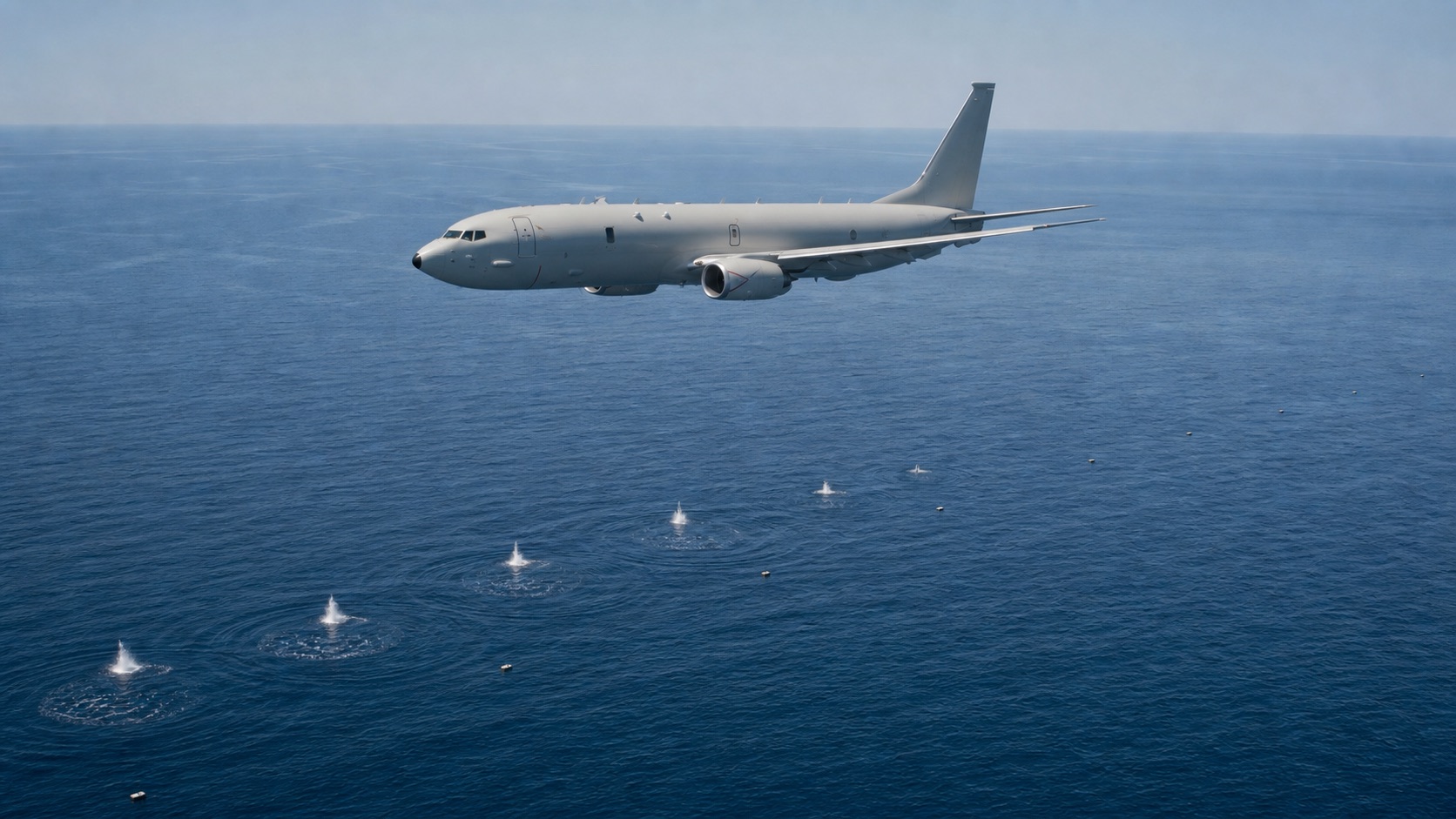 ソノブイを展開して潜水艦を捜索するP-8A級哨戒機